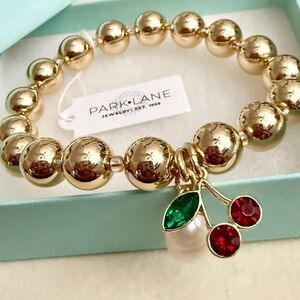 Park Lane Gold Beaded Bracelet with Red and Green Charms